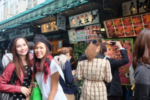 Lining up for our very first taste of authentic Japanese sushi at the Tsukiji market.